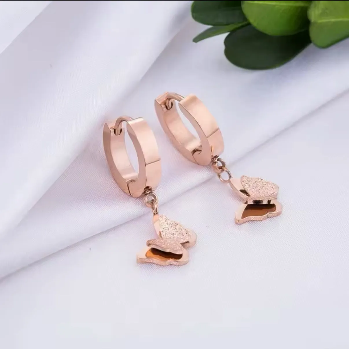 Dangling Frosted Butterfly Huggies Earrings